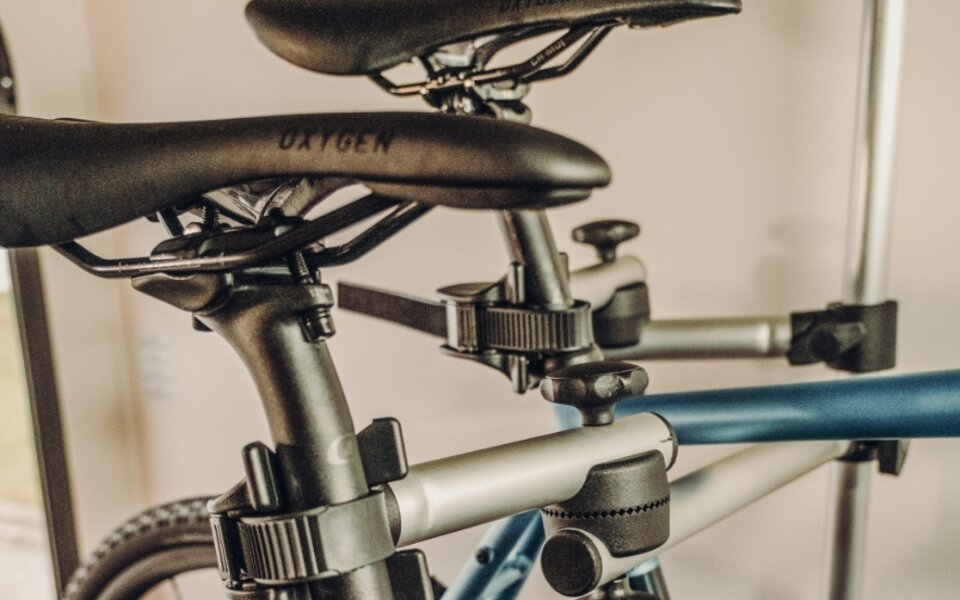 Bicycle saddles and frames secured in the indoor bike rack of a Carado motorhome