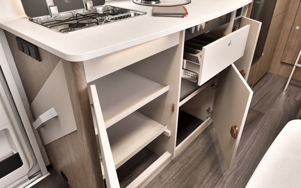 Carado motorhome kitchen with open drawers, shelf compartment, gas hob and sink