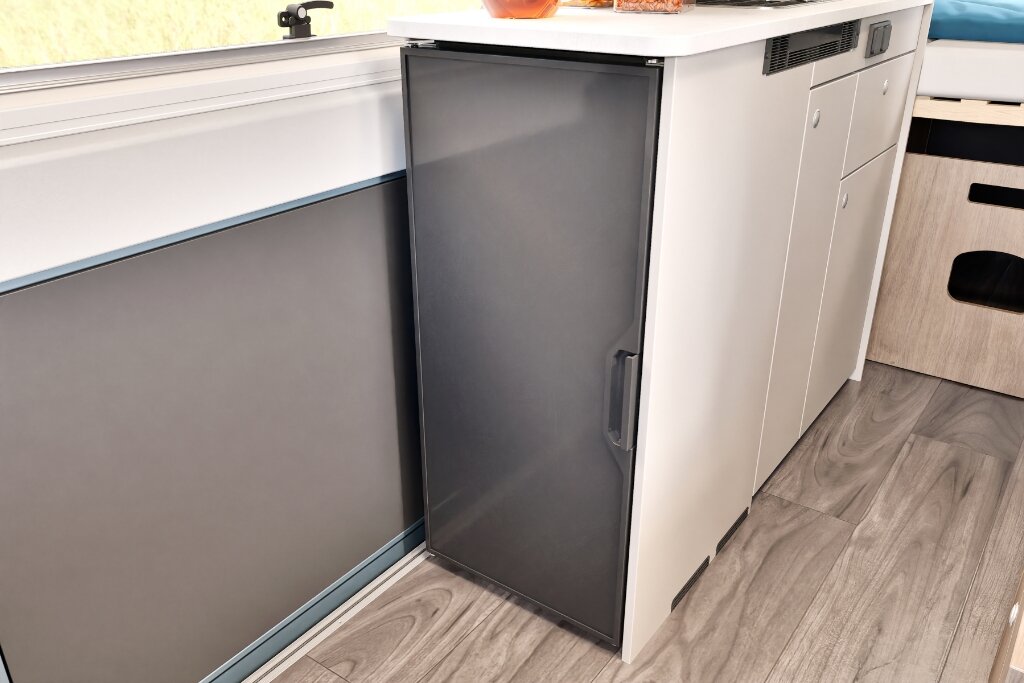 Fridge and kitchen unit in the Carado motorhome with cabinets