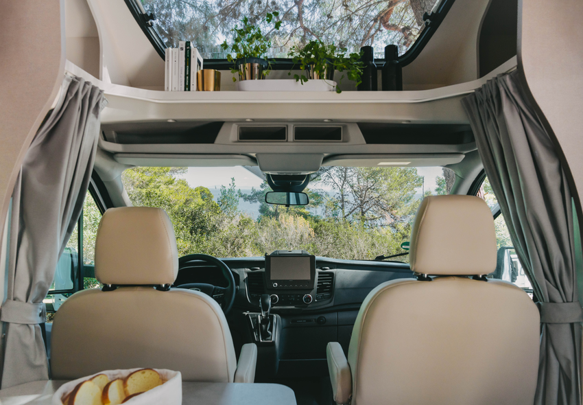 Interior of an Etrusco semi-integrated motorhome on a Ford base with panoramic view and elegant cockpit.