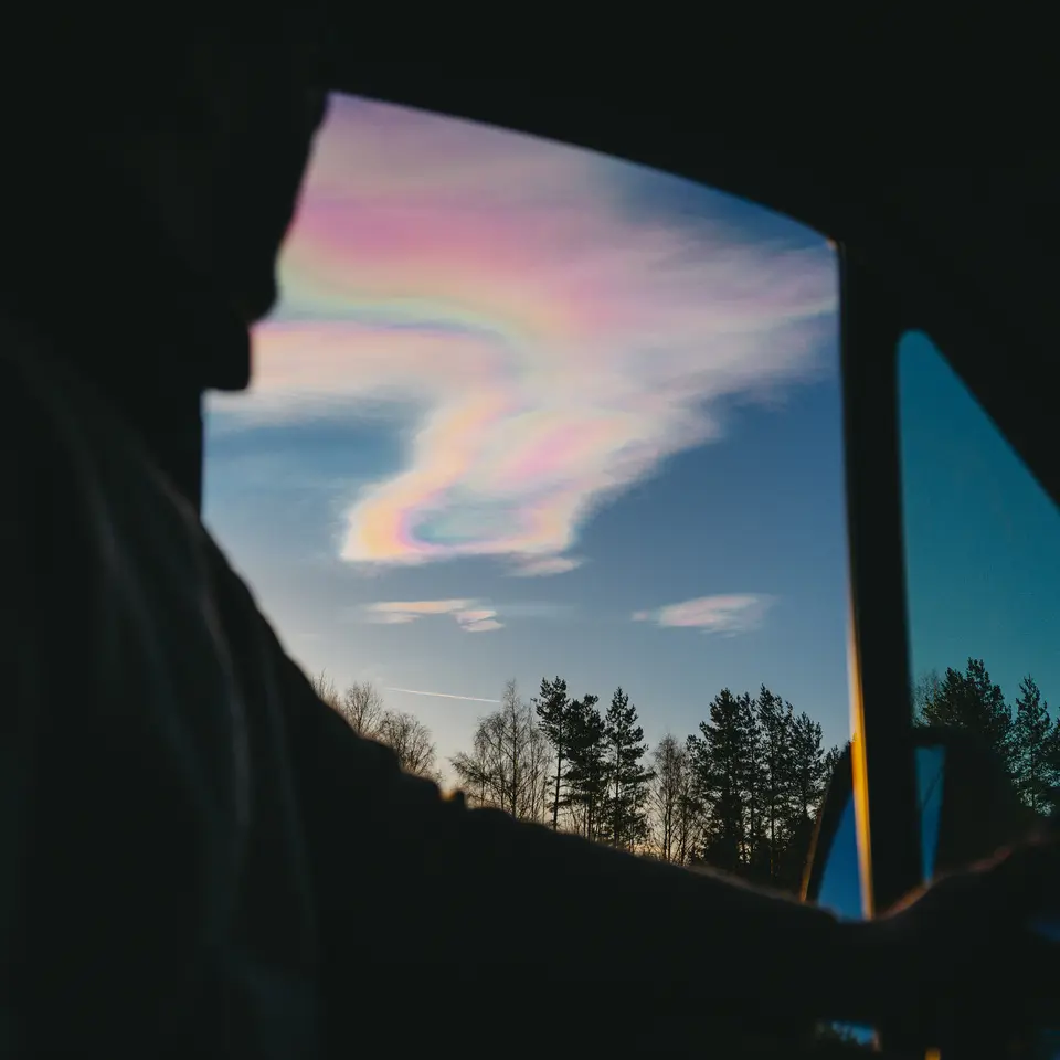 View from a motorhome window of iridescent clouds